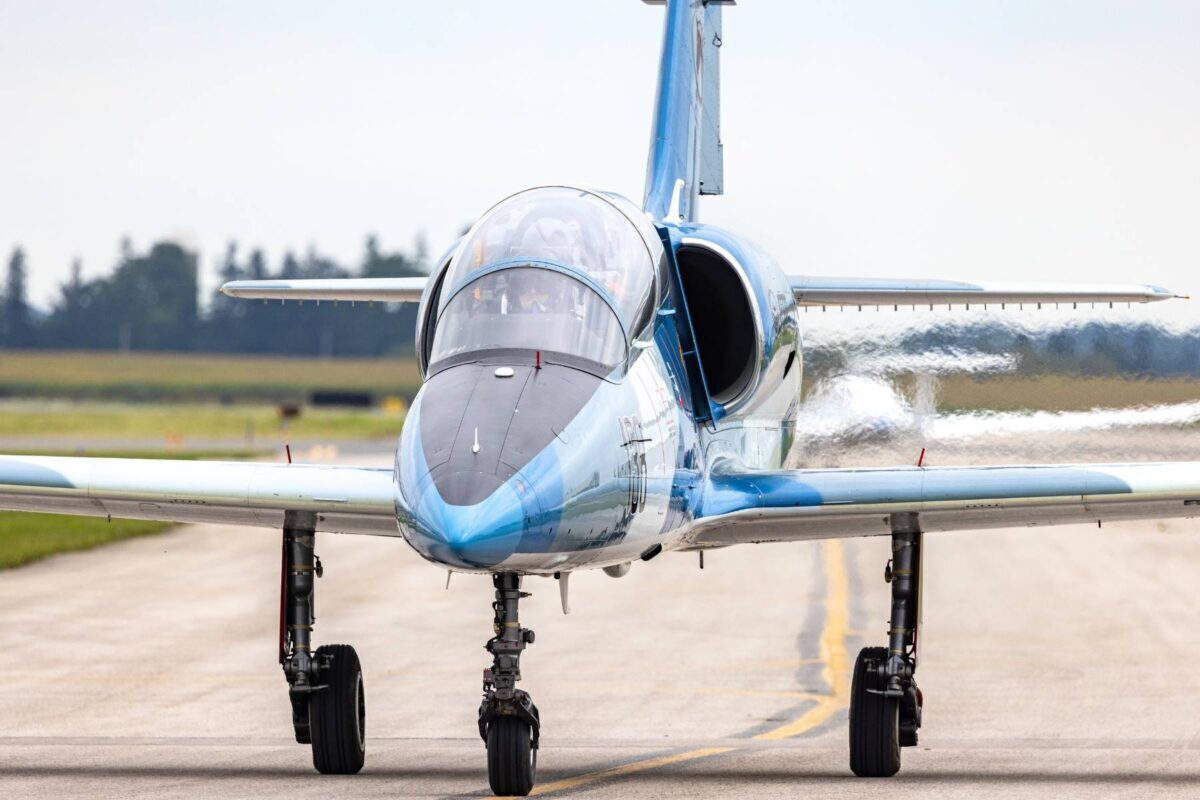 blue L39 jet trainer taxiing