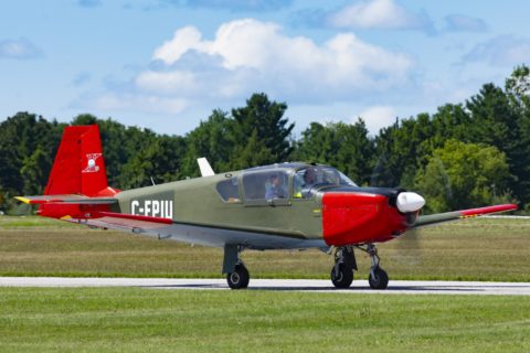 Green and red Brassov airplane