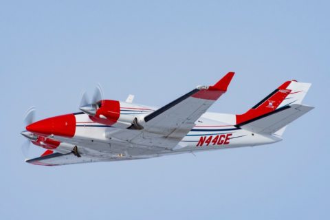 Duke B60 aircraft flying in the air.