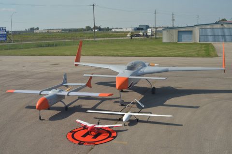 Grey and orange unmanned remotely piloted aircraft.