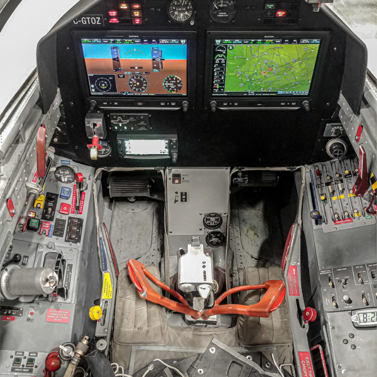L-39 Simulator a student would use for training, showing 2 screens in the cockpit and various buttons & controls on the left and right sides.