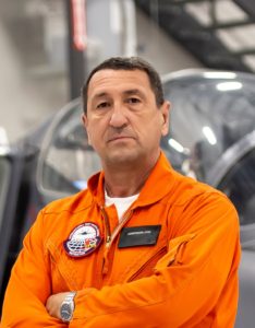 Constantin Stan in an orange flight suit.