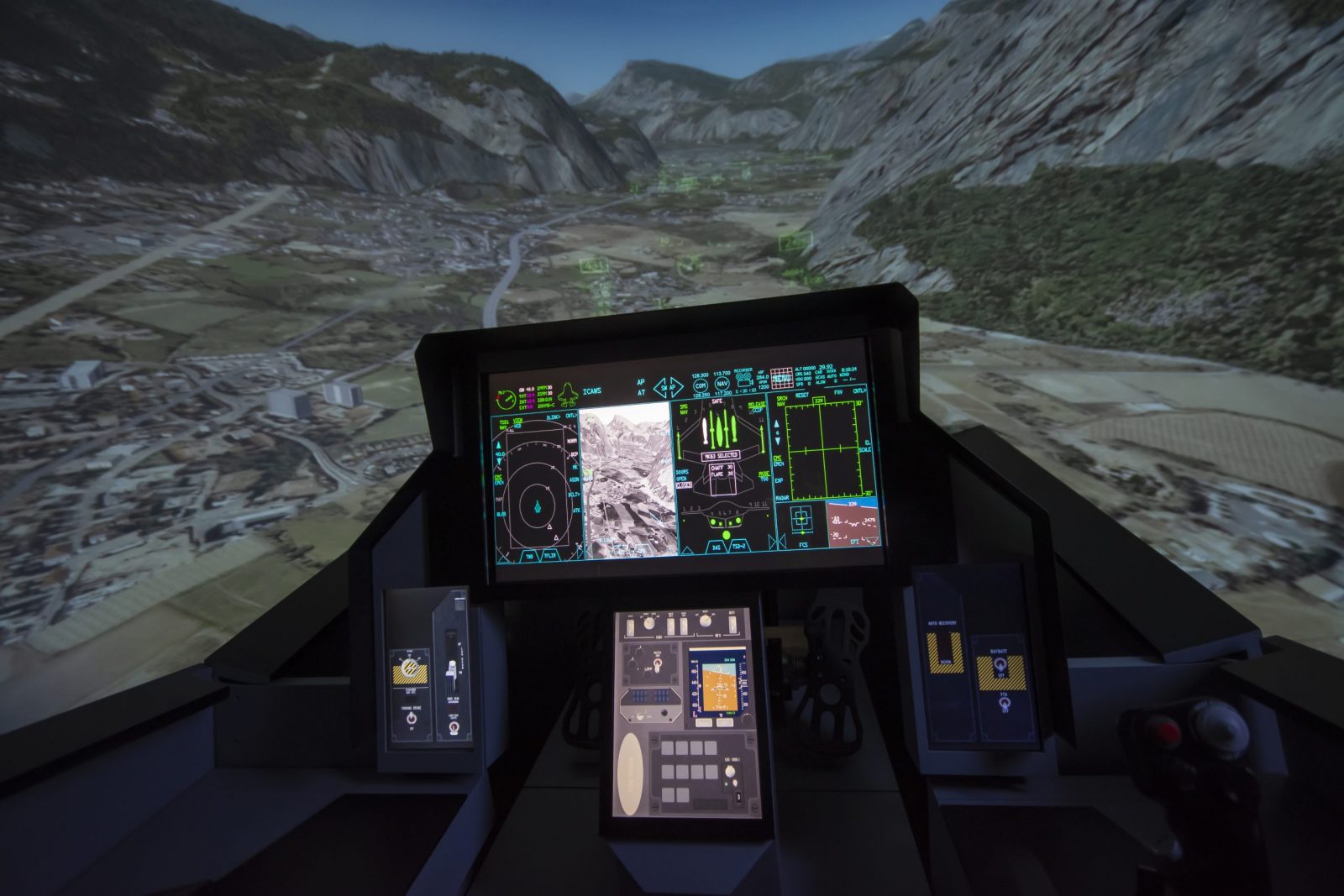 F-18 aircraft simulator with terrain in the background.