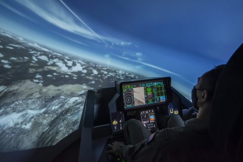 a tactical training student in F-18 aircraft simulator