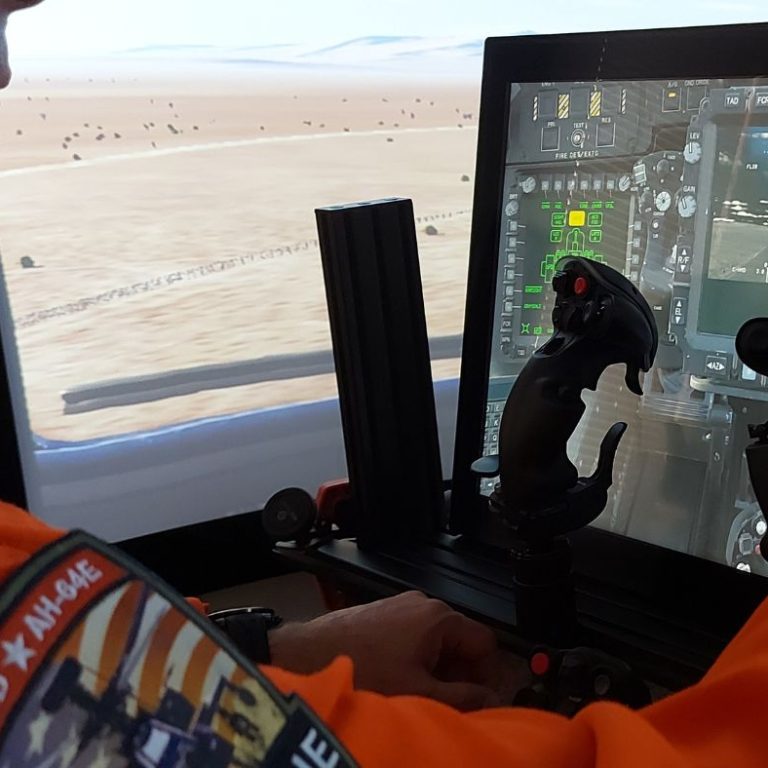 Mark Chivers in attack helicopter cockpit simulator