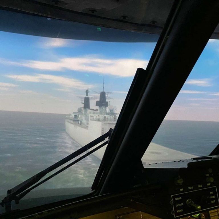cockpit simulator with aircraft carrier on water