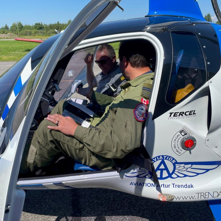 flight test students in blue gyrocopter