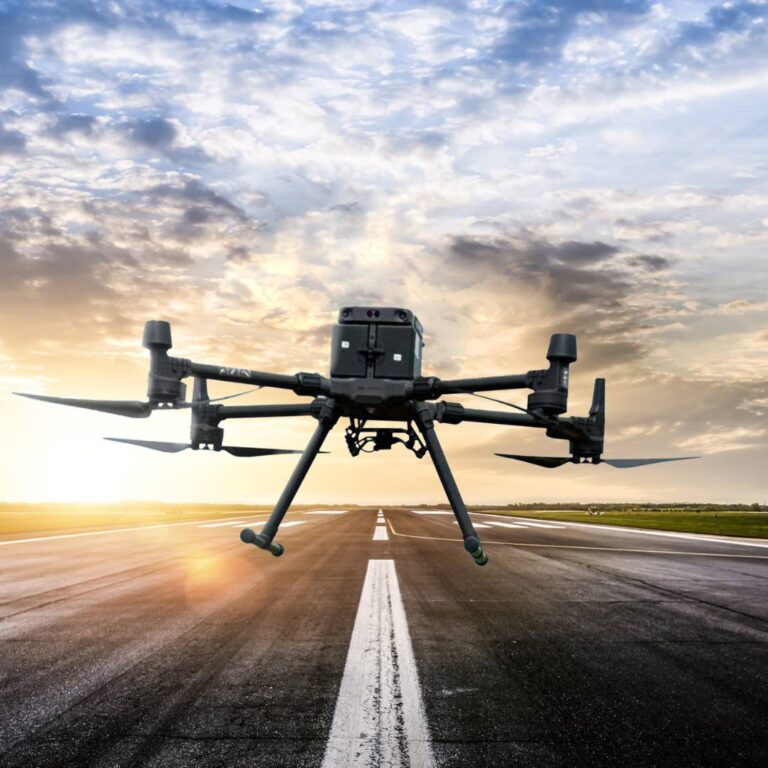 drone flying above runway during sunset