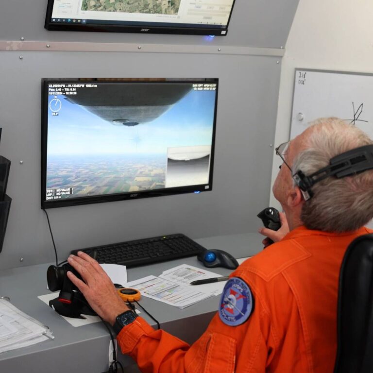 man looking at drone camera pov on screen