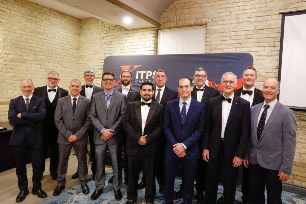 1749656862398 ITPS graduates and instructors standing together