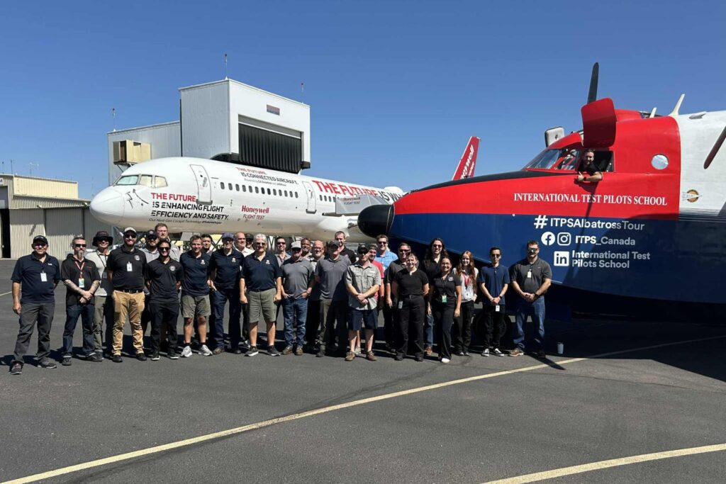 1 Group standing at airport with ITPS HU-16