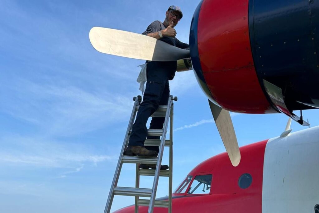 10 Darren standing on ladder at HU-16 propellar