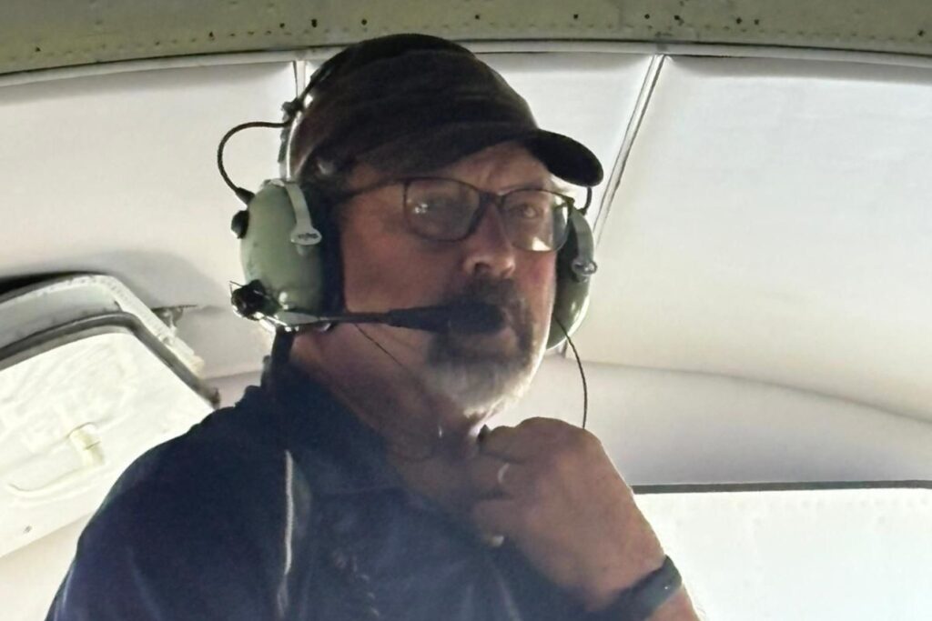 10 man wearing headset in HU-16 Cockpit