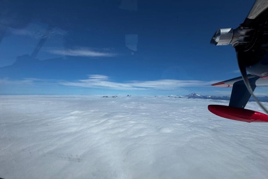 2 hu-16 plane above clouds