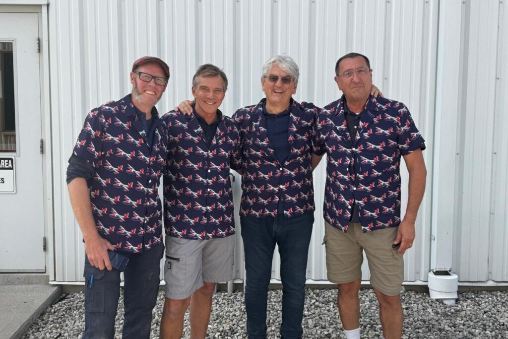 5 ITPS crew standing together wearing HU-16 shirts