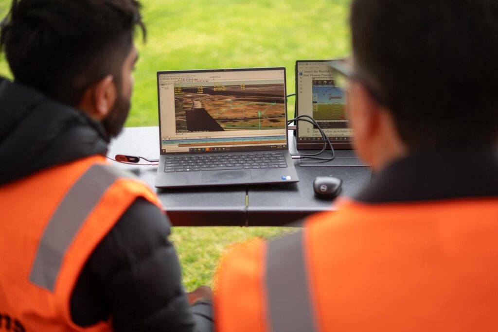 5 two Nova members looking at screen displaying UAS activity