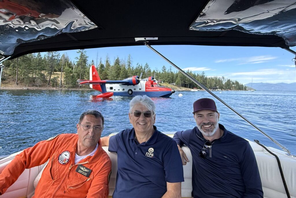 6 Stan Constantin, Giorgio Clementi and Matty Jacobs on boat with HU-16 Seaplane behind them