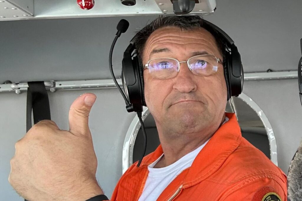 9 Stan Constantin in HU-16 Cockpit giving thumbs up