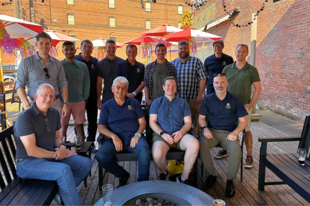 9 ITPS team and friends stand together