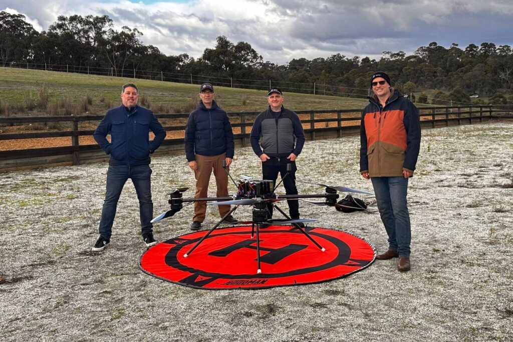 2 Freespace team and ITPS Michael Mulquiney in front of drone in field