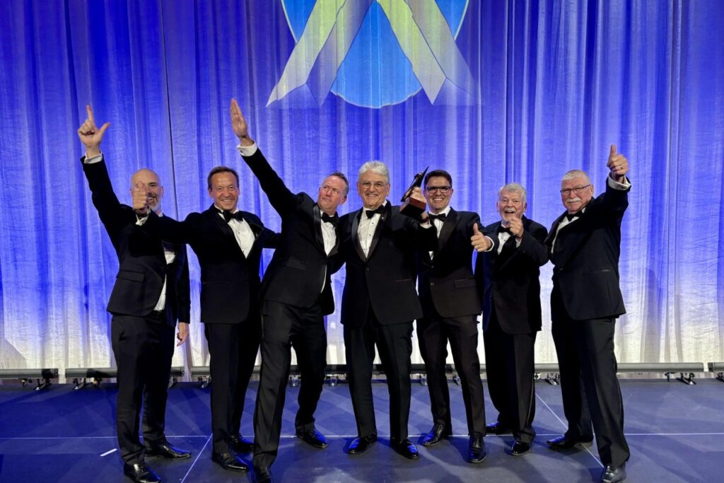 1 ITPS Senior leadership celebrate on SETP stage with J.H. Doolittle Award