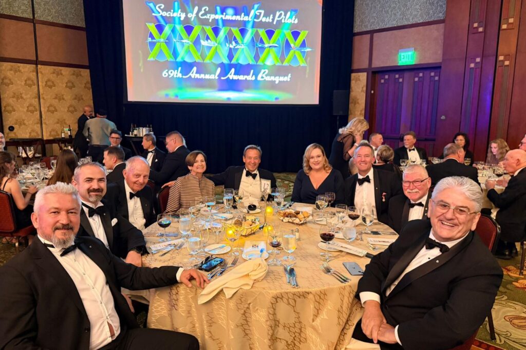 4 ITPS team and graduates at SETP banquet table