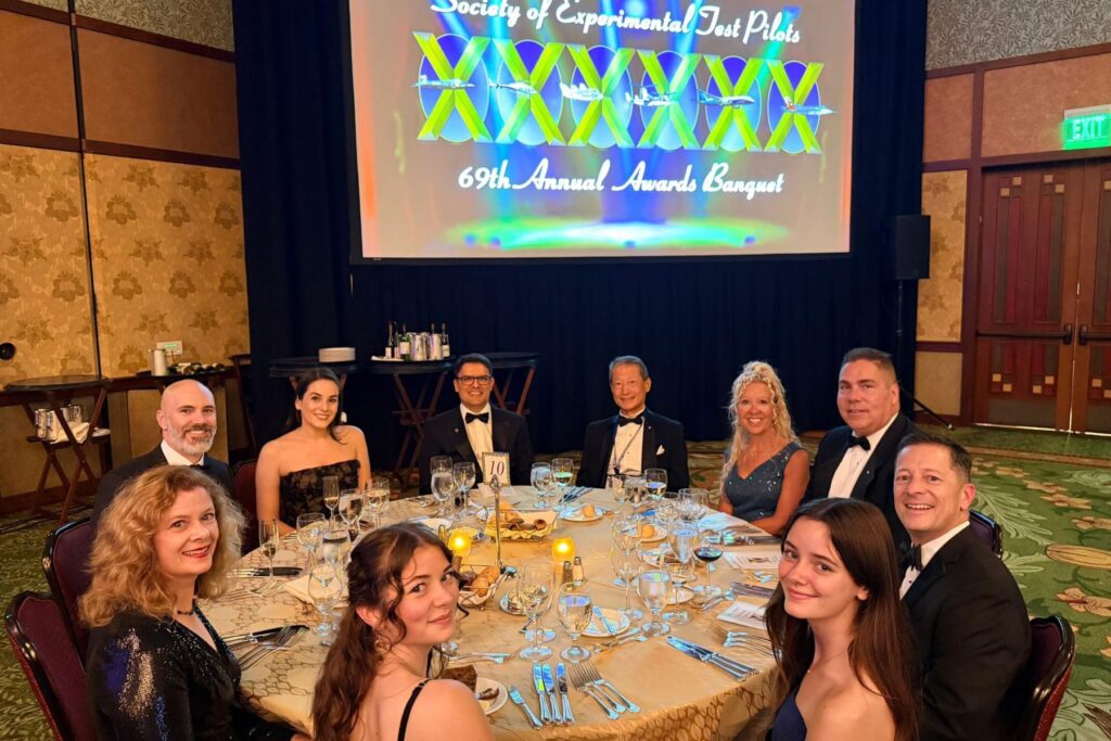 5 ITPS team, friends, and family at SETP banquet table