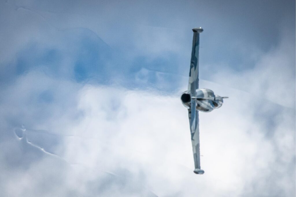 yes Blue L39 jet trainer flying sideways