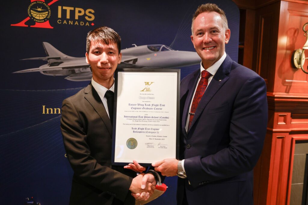 yes (2) ITPS graduate with ITPS CEO, Dave Lohse holding plaque