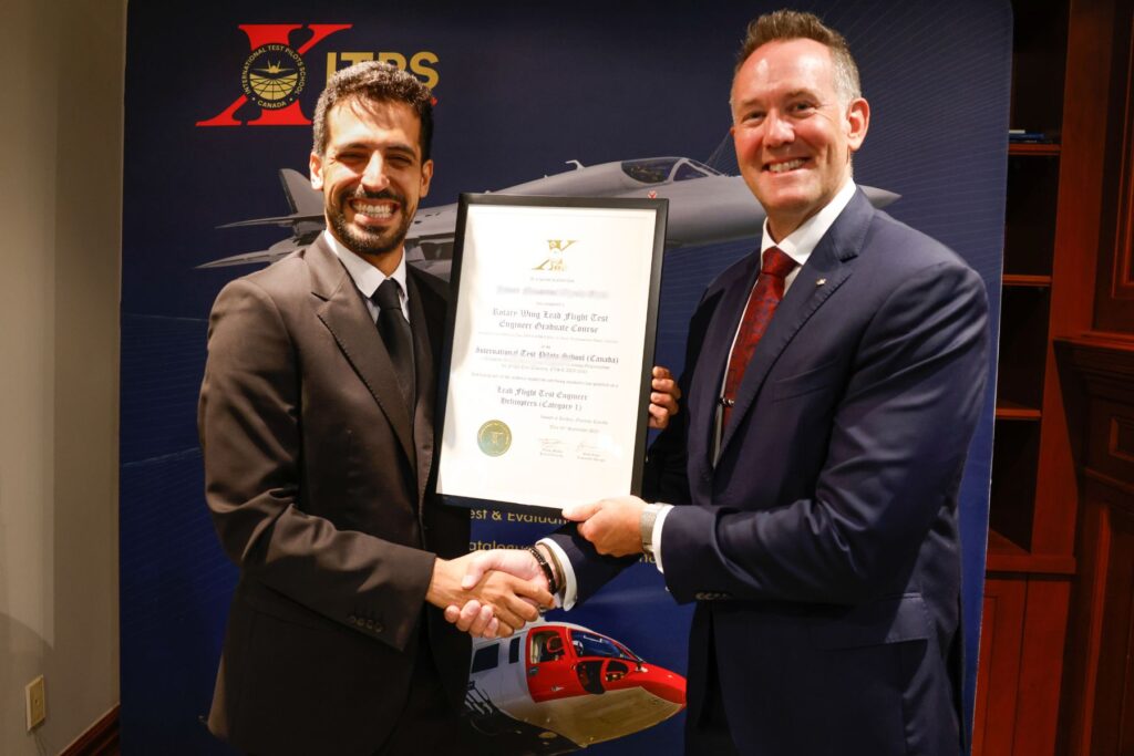 yes (4) ITPS graduate with ITPS CEO, Dave Lohse shaking hands