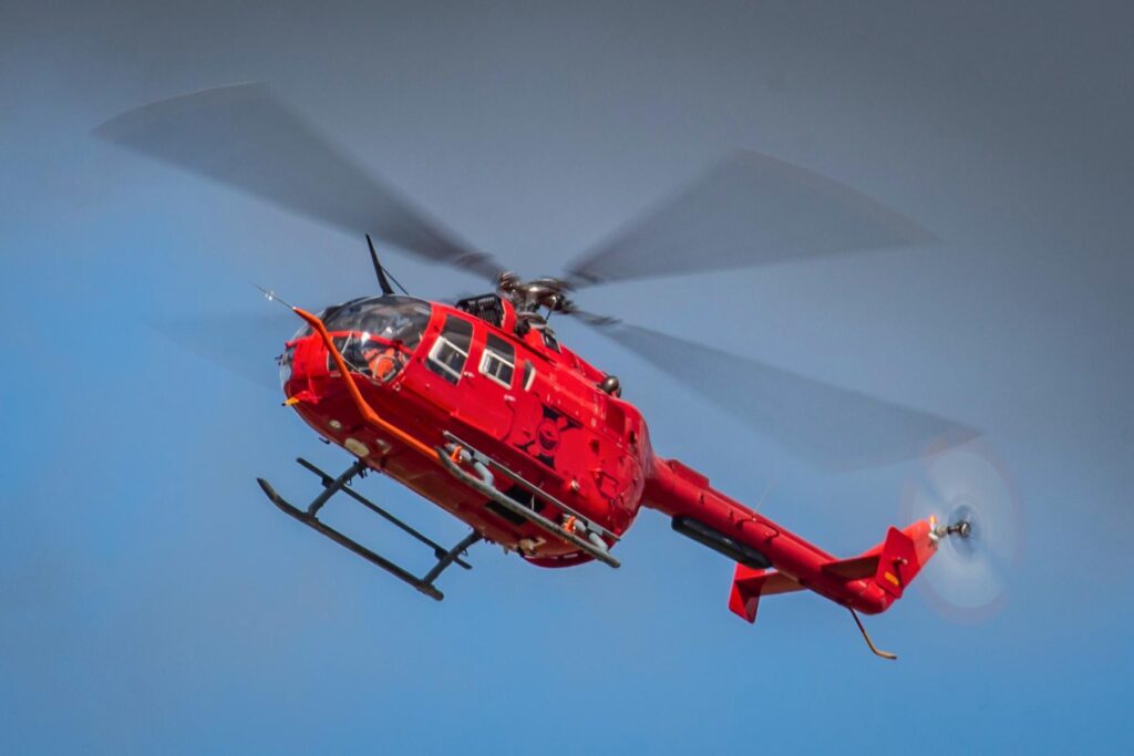 yes (4) Red Bo105 Helicopter flying in airshow london