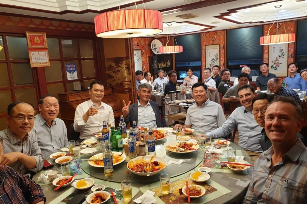5 Dave Lohse in South Korea restaurant seated with Korean Society of Flight Test Seminar attendees
