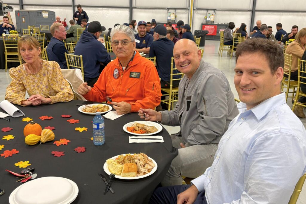 5 ITPS clementi family with visitor at thanksgiving table