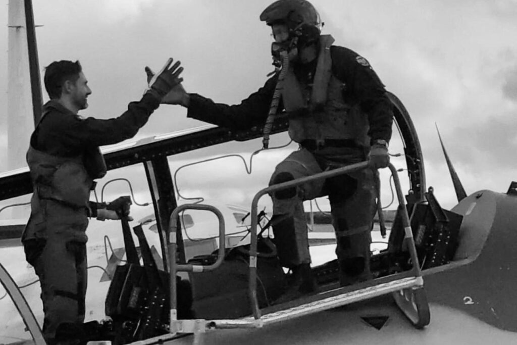 5 Dave Lohse with Leonardo employee shaking hands in Leonardo M-346 Advanced Jet Trainer cockpit