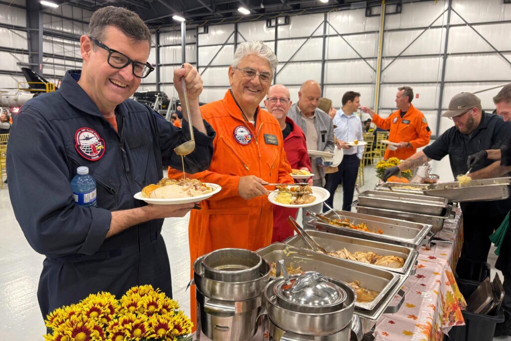 6 ITPS instructor and Giorgio Clementi, pouring gravy on plate