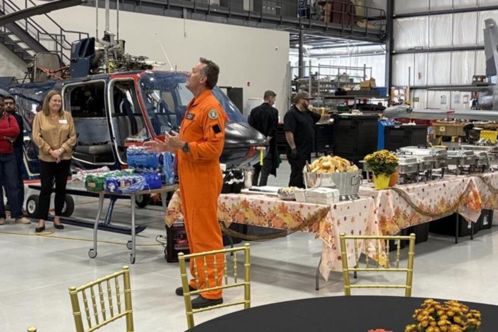 7 Dave Lohse giving speech to ITPS in aircraft hangar