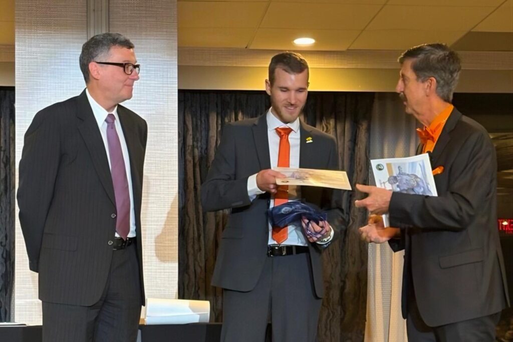 SFTE Savannah wrap up Jeff Canclini, David Ostler presenting attendee with paper