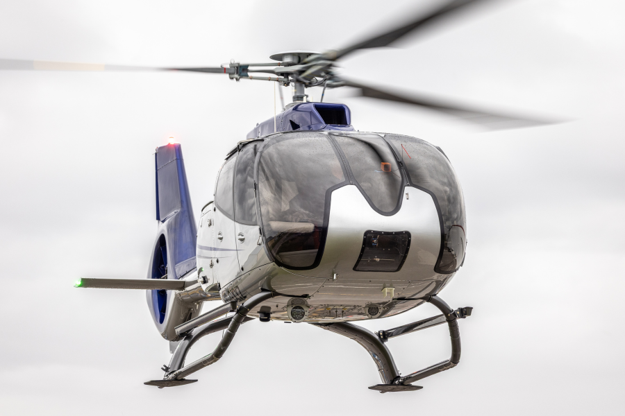 1 (2) Airbus EC130T2 flying