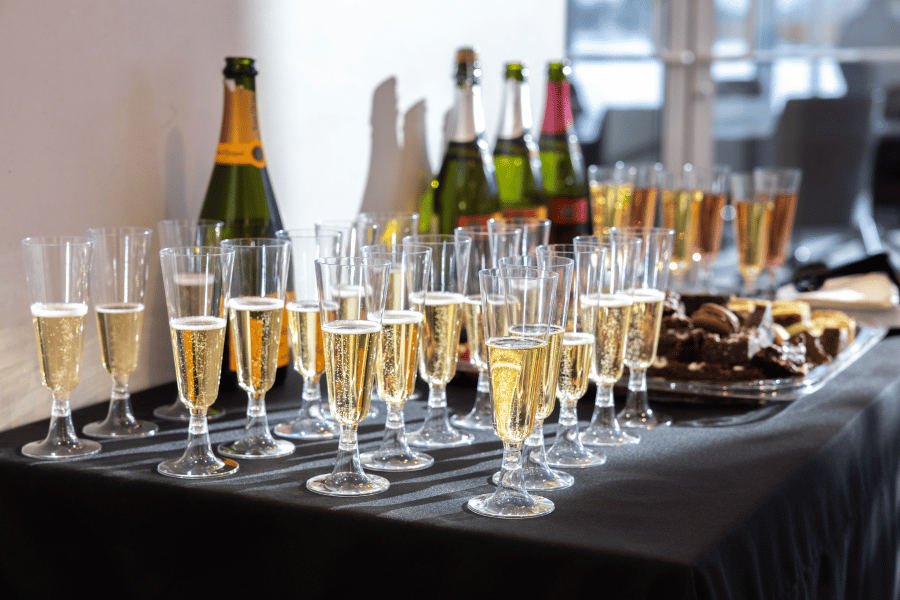 12 table with champagne and desserts