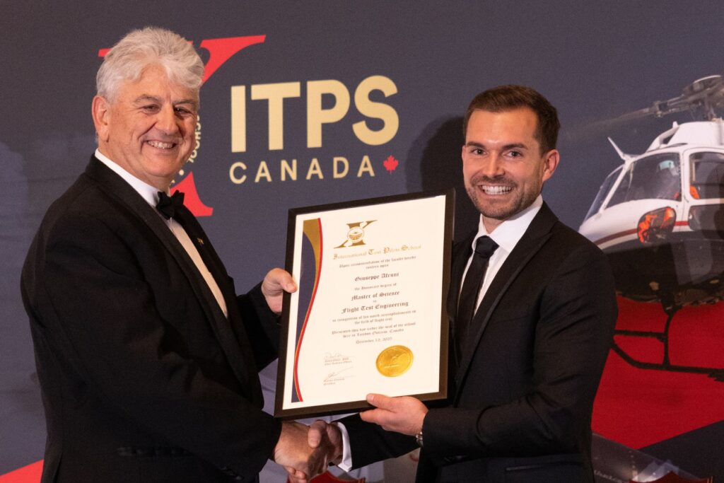 Giorgio Clementi and student holding plaque