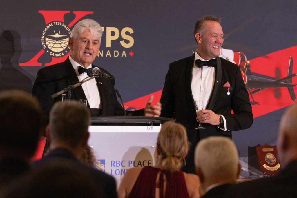 Giorgio Clementi and Dave Lohse at podium of ITPS graduation 2025