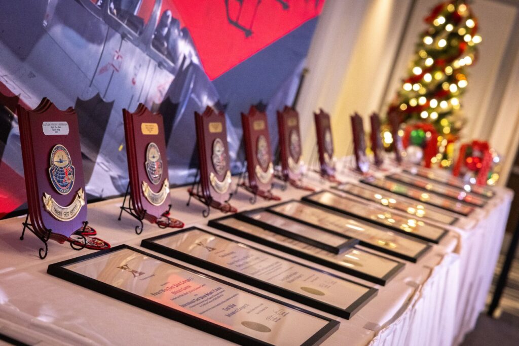 Graduates plaques and shields on table