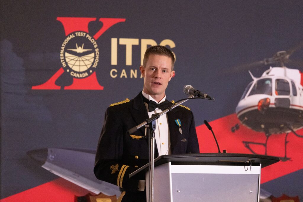 Graduating student speaking to crowd during graduation