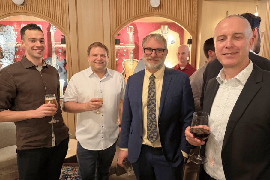 6 ITPS instructors and guests holding drinks at Hard rock hotel event