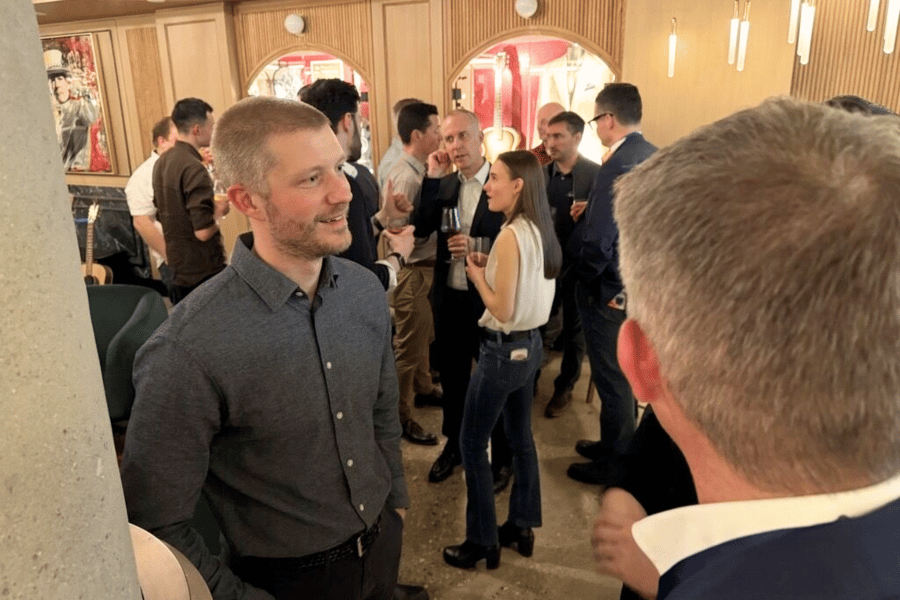 8 guests socializing at ITPS Hard Rock Hotel event