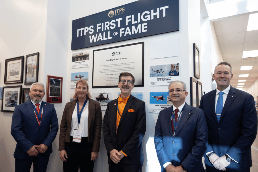 8 Arif Ates, Kelly Latimer, Jeff Canclini, Barbaros Demirbas and Dave Lohse in front of ITPS wall of fame