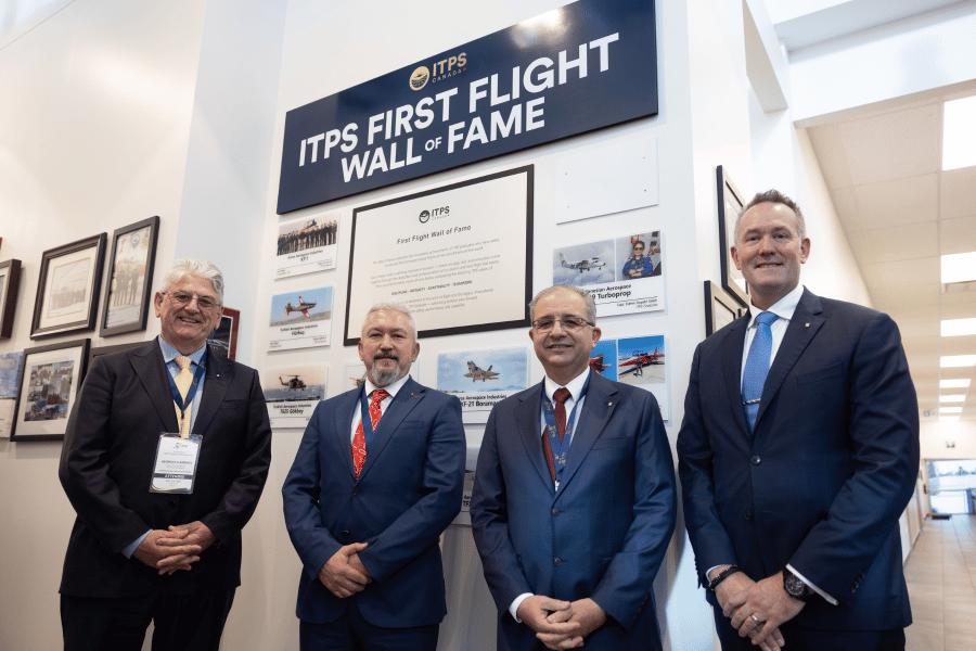 Barbaros, Arif, Lohse, Giorgio Giorgio Clementi and Dave Lohse with TAI alumni with wall of fame