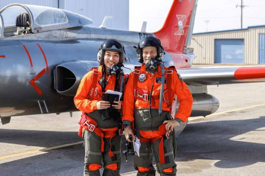 test pilot student and instructor at ITPS in front of L29 jet trainer