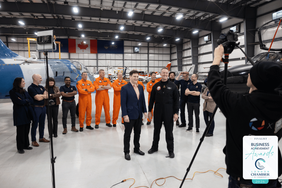David Clementi, and Dave Lohse, in front of ITPS team members in hangar