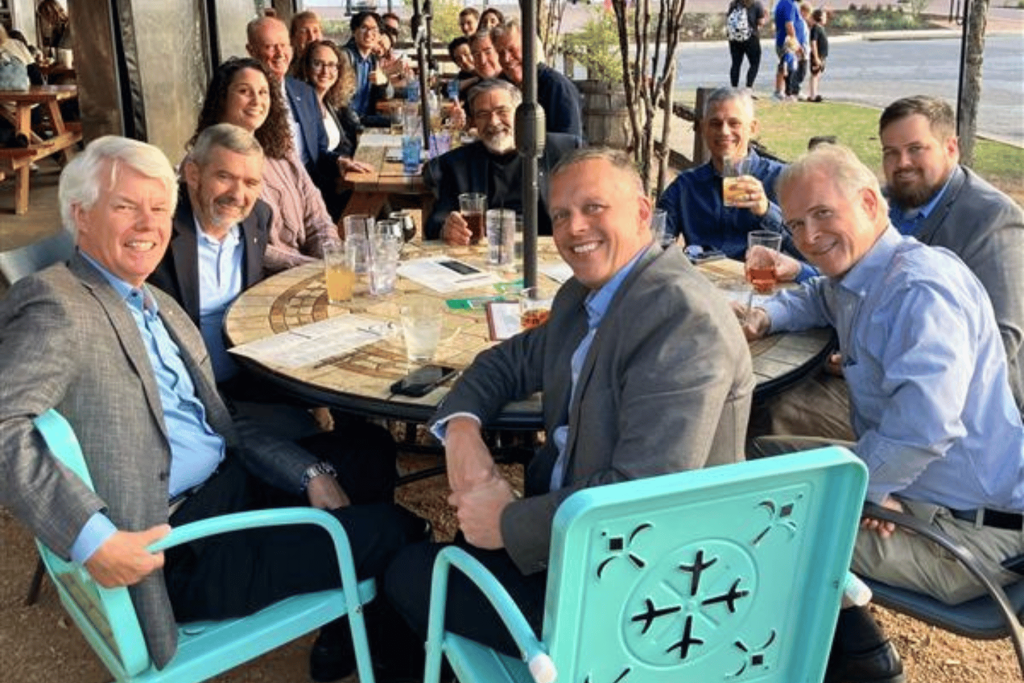 SETP symposium attendees gathered around table